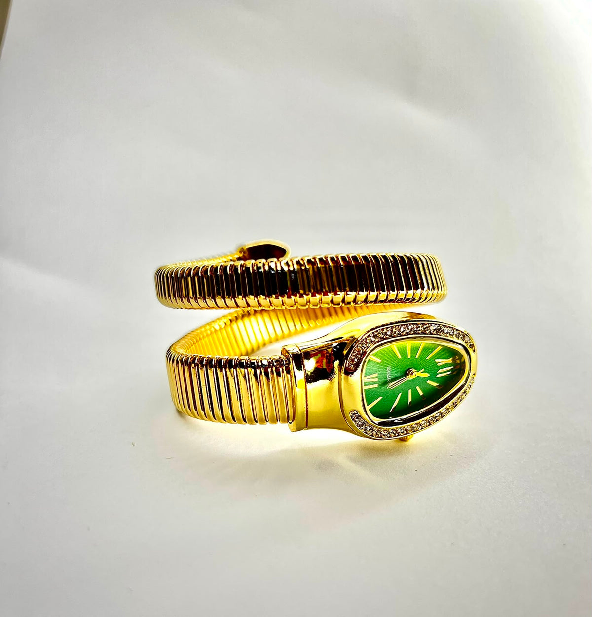 women`s Gold snake wrap watch.