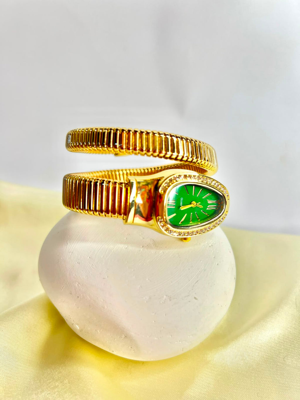 women`s Gold snake wrap watch.