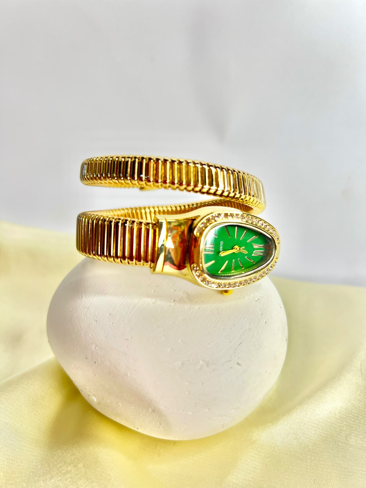 women`s Gold snake wrap watch.